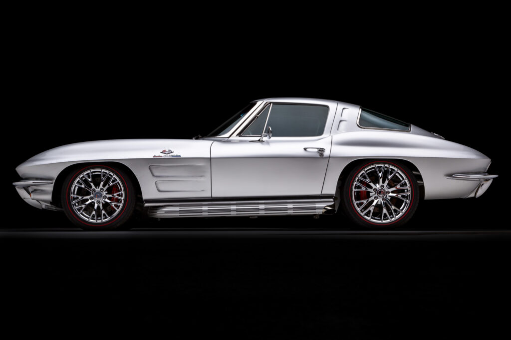 Side profile of a 1963 Split-Window Corvette custom coupe restomod in Silver Pearl built by Verrillo Motor Car Co.
