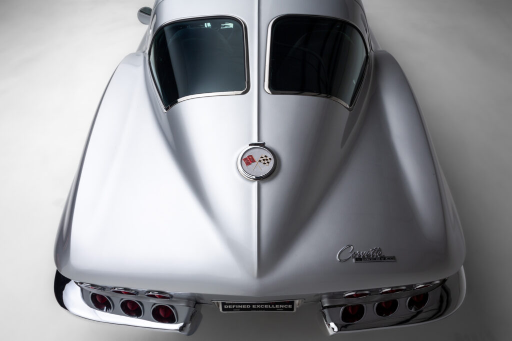 Closeup of the rear windows and taillights of a 1963 Split-Window Corvette custom coupe restomod in Silver Pearl built by Verrillo Motor Car Co.